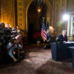 President Donald J. Trump talks with members of the military via video tele conference