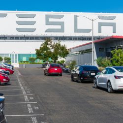 Tesla logo displayed on the exterior wall of Tesla Factory, automobile manufacturing plant in Silicon Valley