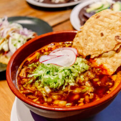 Chicken and corn soup with Mexican lettuce, a traditional pozole