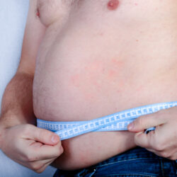 Shirtless overweight caucasian man