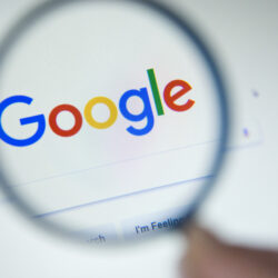 Paris, France – October 19, 2017 : Google.fr homepage on the screen under a magnifying glass. Google is world’s most popular search engine